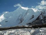 13 Chogolisa Late Afternoon From Shagring Camp On Upper Baltoro Glacier Chogolisa (7665m) is a high snow peak with a distinctive long, almost level summit ridge. Chogolisa I (7665m) is the southwest summit on the left. The slightly lower northeast summit Chogolisa II (7654m) was named Bride Peak by Sir Martin Conway in 1892.